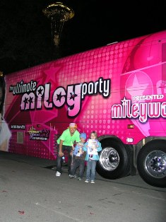 Caleb and friend Michaela with Myke in front of the vendor bus