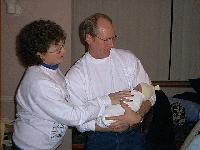 Aunt Midge and Grandpa Don admire Ryley